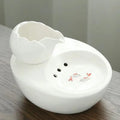 Ceramic pet water fountain with USB pump for cats and other pets to drink water.