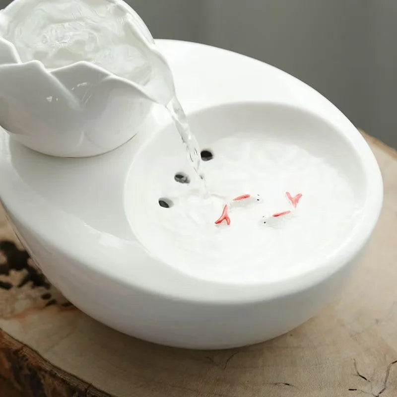 Ceramic pet water fountain with USB pump for cats and other pets to drink water.